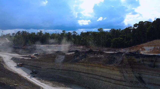 Aerial View of Large Scale Open Pit Coal Mining Operation with Heavy Machinery