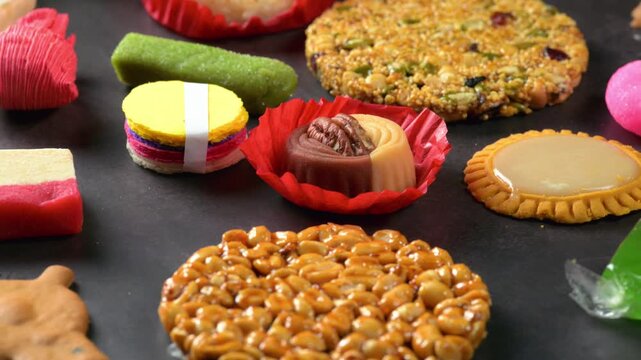 Assortment of colorful Mexican typical candies and confections on a textured surface