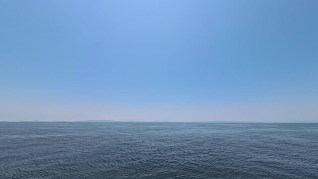 Stunning real-time video clip featuring natural moving sea surface and a clean horizontal line