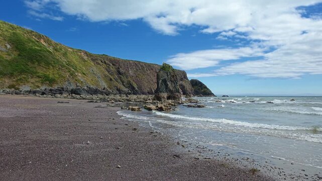 Irish seascape of tranquil beach seasick gentle waves on pebble beach epic locations Copper Coast Waterford