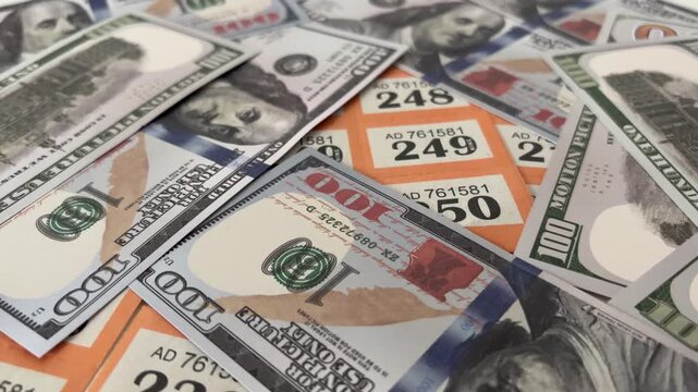 Raffle Tickets Scattered With US Dollar Bills