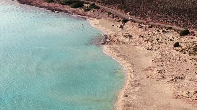 Simos beach coastal dune landscape ecosystem on a sunny day, juniper forests and low Mediterranean shrubs, Elafonisos Island, Aerial view