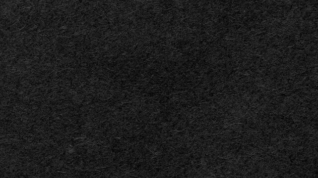 Textured black paper surface a subtle matte paper texture. Ideal for clean,
modern designs. Smooth dusty black paper sheet. Video effect 4k resolution background, grunge backdrop, black paper bg.