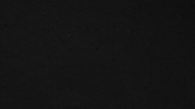 Textured black paper surface a subtle matte paper texture. Ideal for clean,
modern designs. Smooth dusty black paper sheet. Video effect 4k resolution background, grunge backdrop, black paper bg.