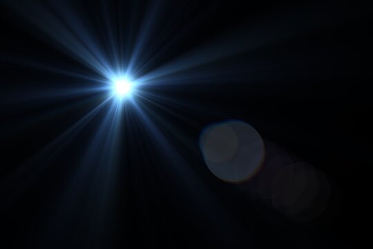 Bright blue lens flare with radiating light rays and circular bokeh effects on a black background.