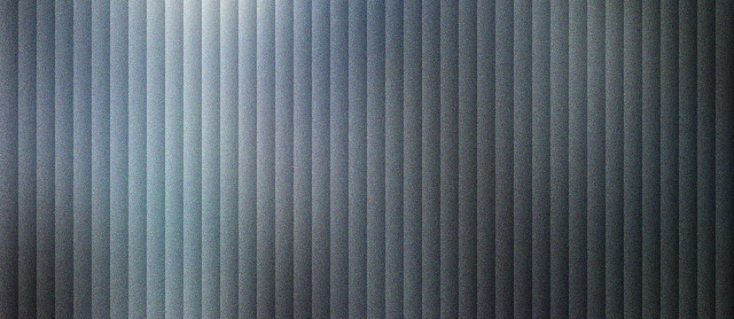 Industrial corrugated metal texture with vertical ridges, brushed steel surface with dark gray metallic finish. Modern architectural aluminum paneling, sleek silver chrome background pattern.