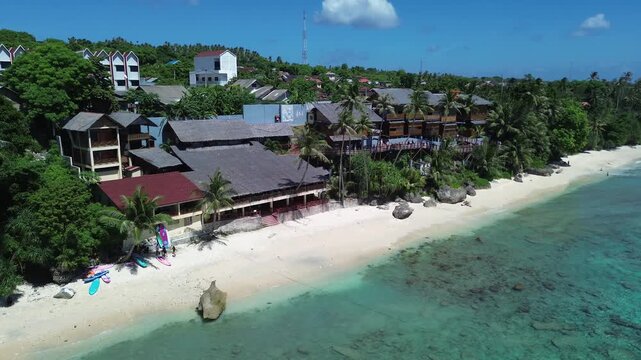 Beautiful Tropical Beachfront with Turquoise Ocean and Coconut Palms in Sumur Tiga Beach, Sabang, Aceh, Indonesia