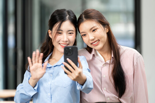 Portrait of Confident Young Asian Businesswoman Smiling at Camera