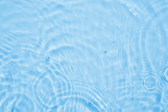 Abstract transparent water shadow surface texture natural ripple on blue background