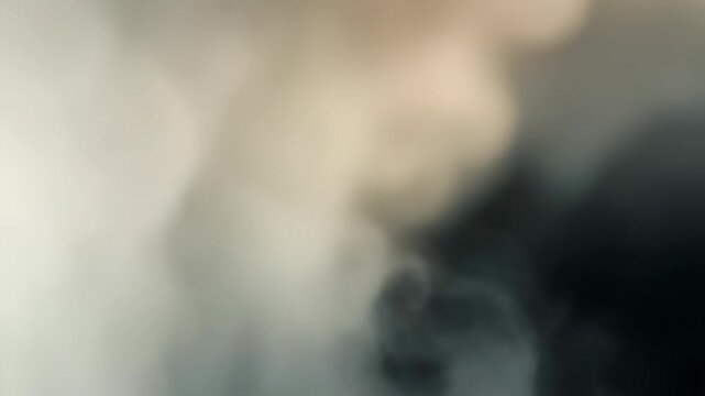 Abstract soft white and beige smoke or fog texture with gentle light and shadow gradients. Atmospheric background perfect for creative projects and modern visual effects