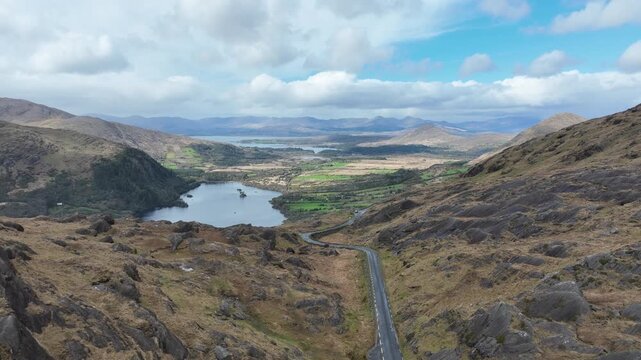 Drone pullback over the top of The Healey Pass on The Cork Kerry border stunning wild mountain scenery Ireland