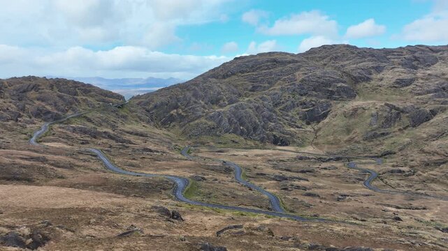 Static aerial of road snaking up mountain to the Healey Pass Cork Kerry Border Ireland