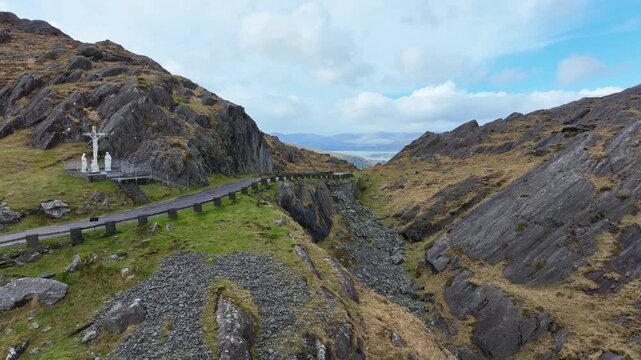 Drone flying slowly over the summit of The Healey Pass Cork Kerry epic drive on the wild Atlantic way Ireland