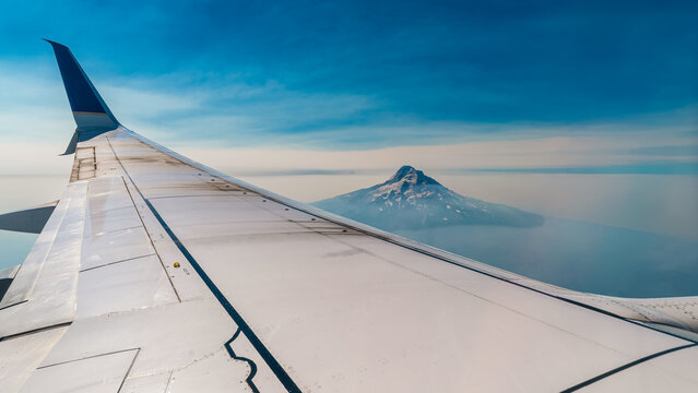 Airplane Wing Over Mount Hood During Flight in Oregon USA