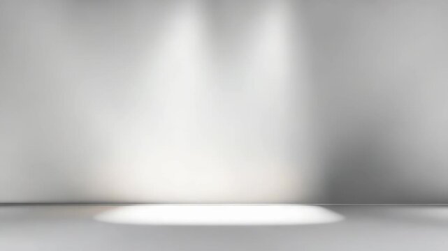 Minimalist empty white wall background with soft spotlight illumination and subtle shadows on the floor. Perfect for product display, presentations, or modern interior design concepts