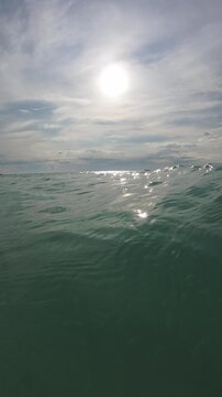 Sun Shining Over Rippling Ocean Waves