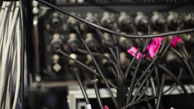 Tangled Audio Cables on XLR Patch Panel in Production Rack