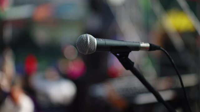 Dynamic Microphone on Stand with Bokeh Background at Outdoor Stage