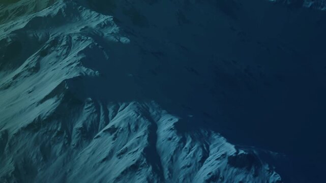 The scene shows a mountain landscape captured in the evening. The light creates shadows on the rocky surface. The colors blend softly as the day transitions to night.