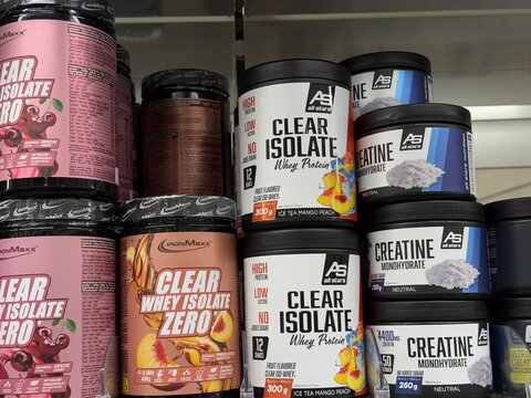 Mallorca, spain, july 06, 2026, sports nutrition shelf displaying various whey protein isolate and creatine monohydrate supplements in retail store