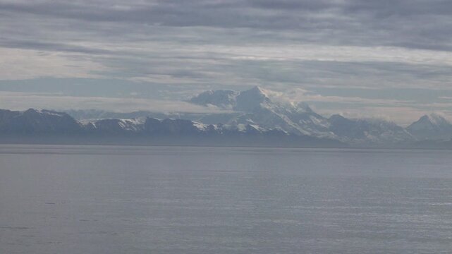 a wide shot of the snow covered mt saint elias range from a cruise ship at alaska of the usa