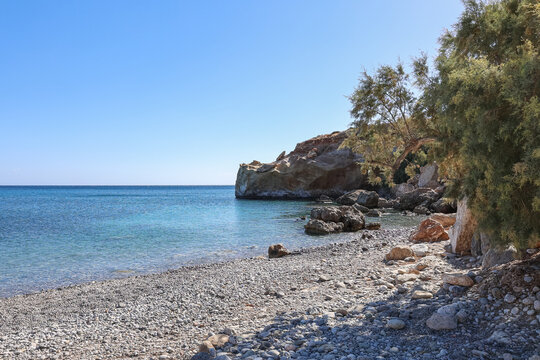 Pebble beach and rocky coastline near Staousa Beach, Sitia, Crete, Greece