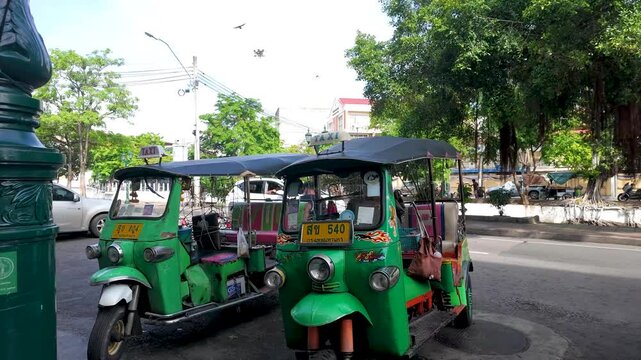 Green Tuk Tuk Auto Rickshaws Parked on a Bangkok Street