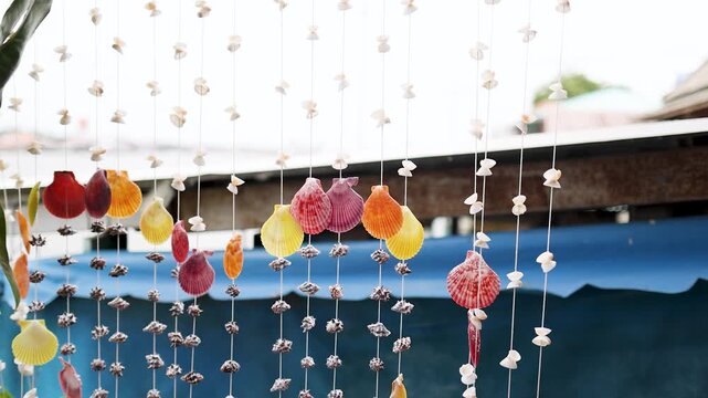 Colorful Seashell Curtain Hanging at a Tropical Outdoor Market