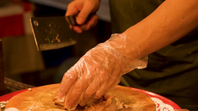Street Food Chef Slicing Roasted Pork on Wooden Chopping Board