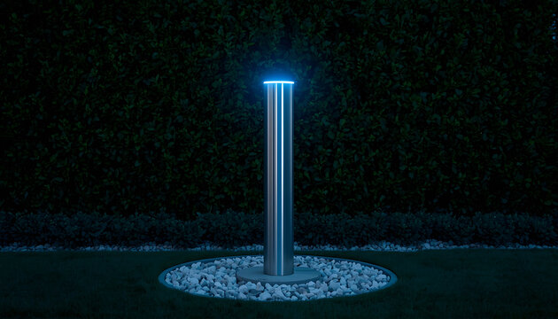 Glowing Blue Light Post on Gravel at Night