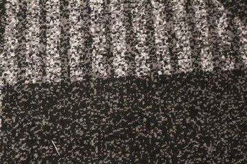 Close up of tufted surface with black and gray combination. Seamless generic carpet fabric pattern background texture. Geometric abstract pattern © andi
