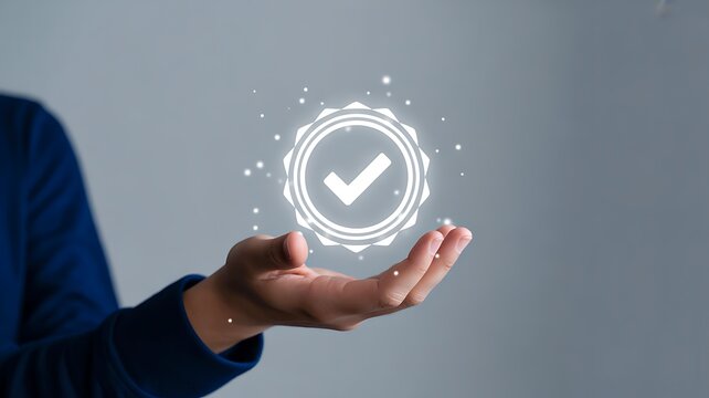 Hand holding glowing checkmark icon representing approval verification and successful business confirmation concept
