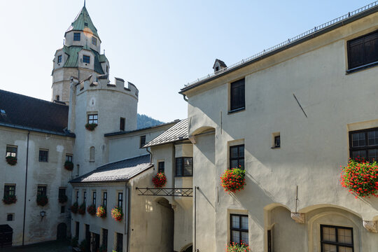 Historic Castle Courtyard With Tower and Residential Buildings