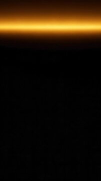 Bright golden light illuminates abstract horizontal background, radiating energy and warmth sunset hues evoke awe, day transitions to night, peacefulness