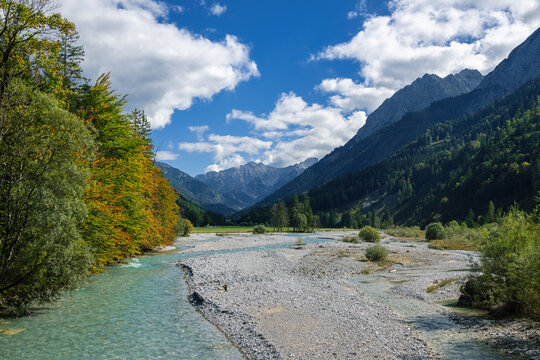 Landscape of Mountains, river, forest and cloudy blue sky