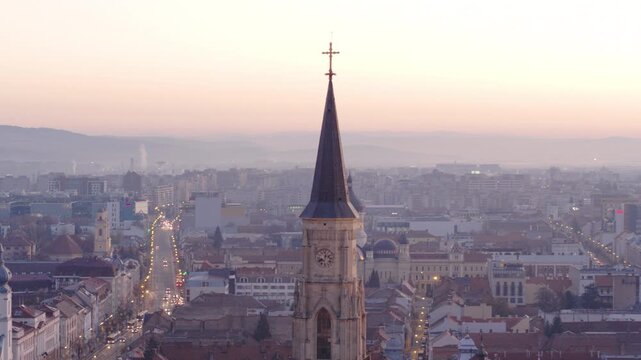 Aerial tracking shot of St. Michael's Church tower in Cluj-Napoca