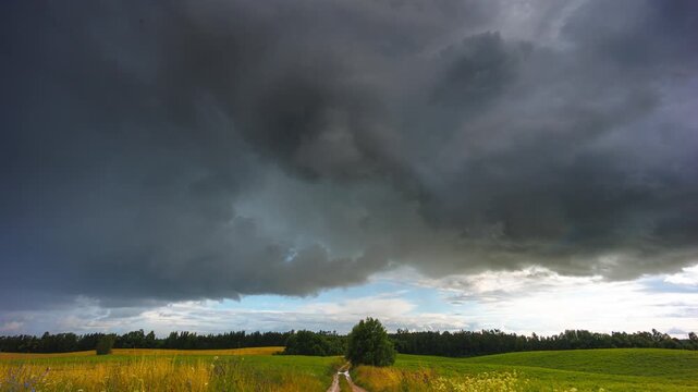 Storm clouds moving in a Timelapse. Summer storm with cumulus clouds and rain