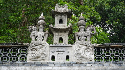 Fototapeta premium Buddhist Art Collection of Longtan Ancient Temple in Pujiang: Stone Carvings, Wood Carvings, and Architectural Artifacts
