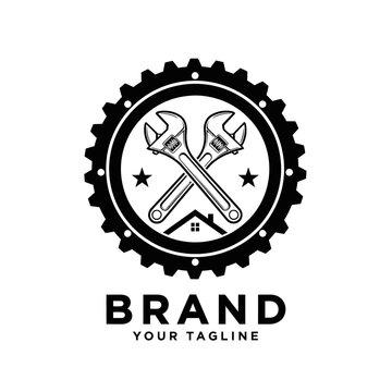 Industrial gear and crossed wrenches plumbing brand logo.