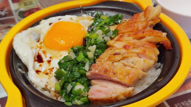 Hong Kong Style Scallion Oil Chicken Chop Rice Handheld Slow Pan Shot