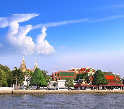 Roofs of Grand palace and Wat Phra Kaew, sightseeing landmark of Bangkok, Thailand. Famous tourist attraction boat ride on Chao Phraya river. Summer vacation, topic of travel, trip, cruises, tour