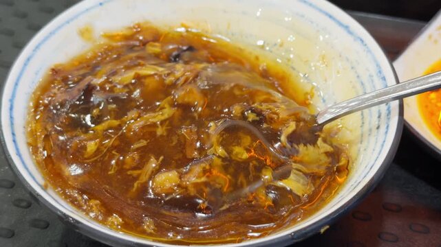 Chinese Bowl Shark Fin Soup Spoon Lifting Close-Up Cantonese Street Food