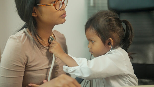 Child Pretending to Be a Doctor During Family Role Play