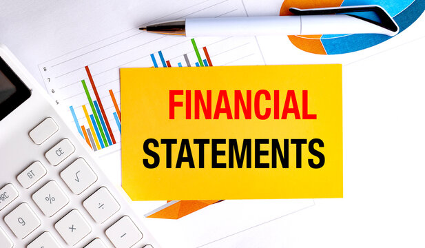 Financial statements concept with financial reports calculator and pen on office desk representing accounting reporting business