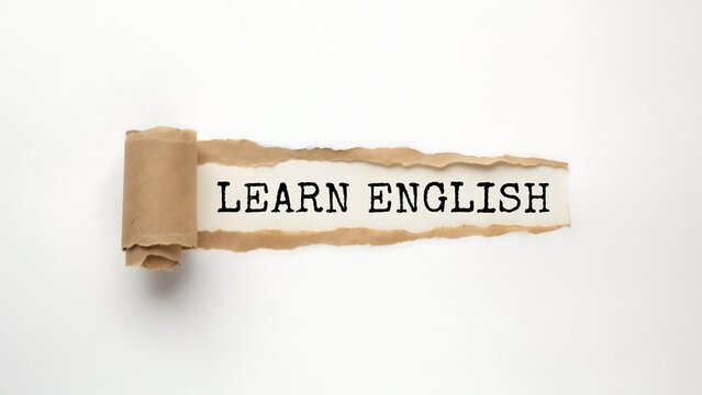 Torn Paper Revealing Learn English Message in Classroom for Language Education Concept