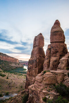 Dramatic red rock formations over a desert canyon