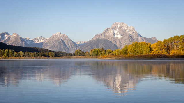 Autumn Aspen Trees Along Calm Lake With Grand Teton Mountain Ref