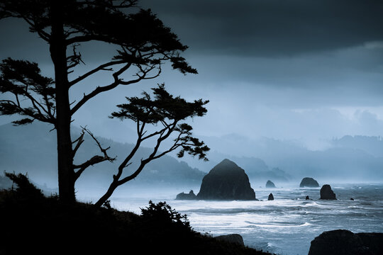 Dramatic Oregon Coastline with famous Haystock Rock and stormy sea, Cannon Beach, Oregon, PNW, USA