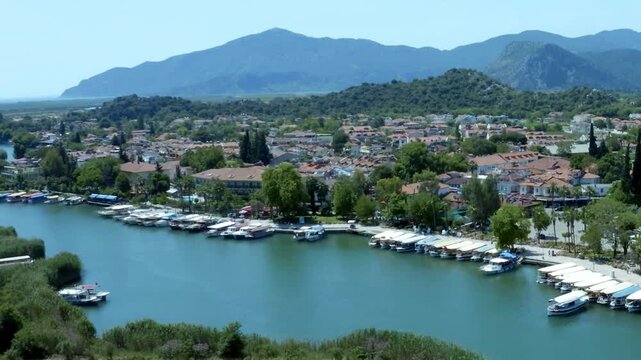 Scenic Dalyan Canal with River Boats and Lush Nature Turkey