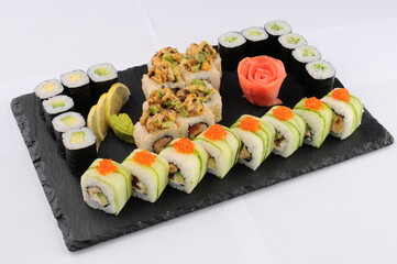 Assorted Sushi Rolls Platter on Black Slate Board © polakravis
